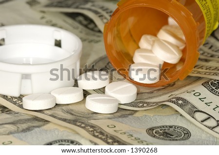 Pills on Money - High Cost of Medicine Concept