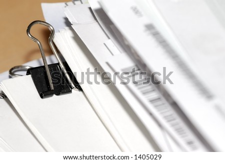 Paperclip and Stack of Paper
