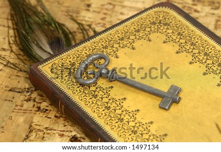 Key on an Old Book - Key To Knowledge Concept