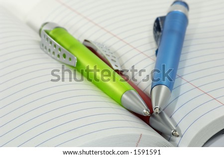 Ballpoint Pens in a Notebook