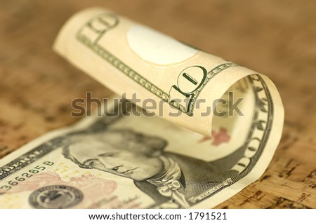 Photo of a Curled Ten Dollar Bill