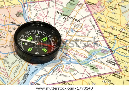 Photo of a Compass on a Map - Travel Concept