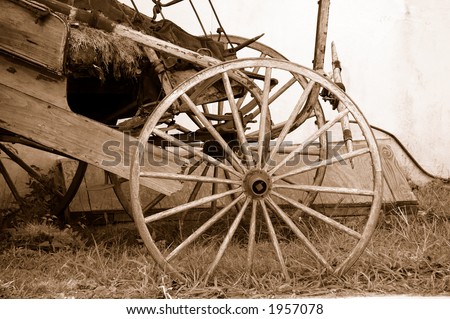 Photo of a Vintage Wooden Wagon Wheel in Sepia Tone