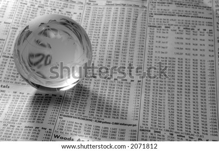 Photo of a Glass Globe on a FInancial Newspaper - Black and White