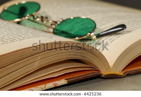 Photo of a Book and Glasses - Education Related