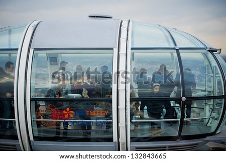 LONDON, UNITED KINGDOM - FEBRUARY 17, 2012: A Participants of attraction London Eye in a cabin of a wheel of a review on February 17, 2012 in London, United Kingdom of Great Britain.