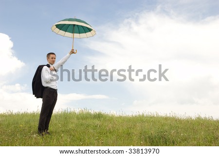 Business protection conception businessman with umbrella