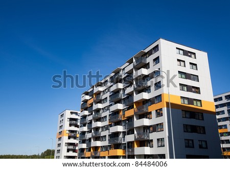 Modern and new apartment building. Multistoried modern, new and stylish living block of flats. Real estate. New house.Newly built block of flats