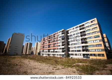 Modern and new apartment building. Multistoried modern, new and stylish living block of flats. Real estate. New house.Newly built block of flats.