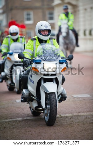 London - Feb 17: Special Escort Group Police Motorcyclists On The Street Near Buckingham Palace On Feb. 17, 2012 In London, Uk. The Unit Provides Motorcycle Escorts For Members Of The Royal Family.