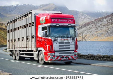 SNOWDONIA-MAR 25: Scania 114L truck on a road on Mar. 25, 2014 in Snowdonia, Wales, UK. Scania is a major Swedish automotive manufacturer of commercial vehicles - specifically heavy trucks and buses.