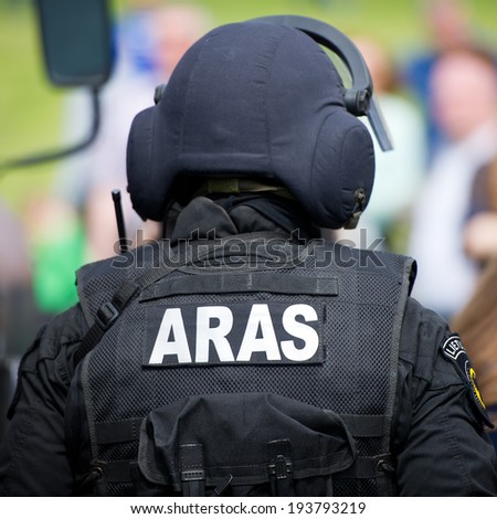 VILNIUS, LITHUANIA - MAY 17: Lithuanian Police Anti-terrorist Operations Unit ARAS officer during Public and Military Day Festival held by the White Bridge on May 17, 2014 in Vilnius, Lithuania.