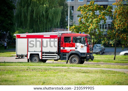 VILNIUS - JULY 25: Fire Truck MAN on July 25, 2014 in Vilnius, Lithuania. A firefighter (also known as a fireman) is a rescuer extensively trained in firefighting.