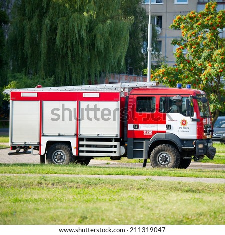 VILNIUS - JULY 25: Fire Truck MAN on July 25, 2014 in Vilnius, Lithuania. A firefighter (also known as a fireman) is a rescuer extensively trained in firefighting.