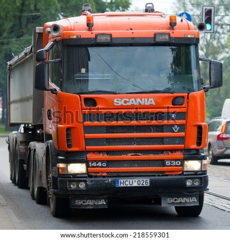 RIGA - SEP 8: Scania 114G V8 530 truck on a road on Sep. 8, 2014 in Riga, Latvia. Scania is a major Swedish automotive manufacturer of commercial vehicles - specifically heavy trucks and buses.