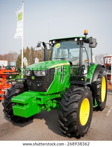 KAUNAS-MAR 26: John Deere 6110 RC Agricultural Tractor on display on Mar. 26, 2015 in Kaunas, Lithuania. John Deere-Deere & Company is the leading manufacturer of agricultural machinery in the world.
