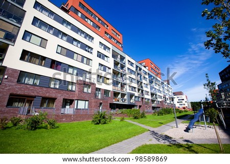 Modern and new apartment building. Multistoried, modern, new and stylish living block of flats. Real estate. New house. Newly built block of flats