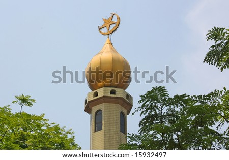 stock-photo-arabic-islam-mosque-tower-with-crescent-and-star-in-an-oasis-15932497.jpg