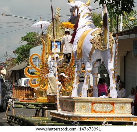 DENPASAR, INDONESIA - MAY 12: The back view of the white bull sarcophagus to be paraded down a street to  a Balinese Ngaben or cremation ceremony in Ubud, Denpasar, Bali, Indonesia on May 12, 2013.