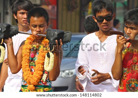 BANGKOK, THAILAND - OCTOBER 19: Traditional warriors or Mah Song with piercings in a bizarre ritual of mutilation for the Phuket Vegetarian Festival in Phuket, Bangkok, Thailand on October 19, 2012.