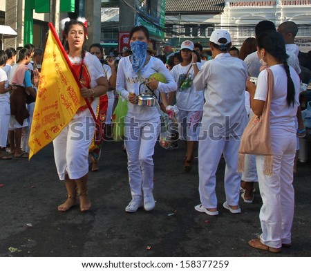 PHUKET, THAILAND - OCTOBER 11: A traditional female Mah Song or Warrior in the street procession of the Phuket Vegetarian Festival at Phuket Town, Phuket, Thailand on the 11th October, 2013.