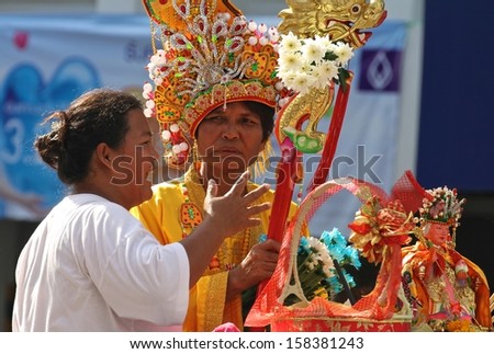 PHUKET, THAILAND - OCTOBER 11: A traditional female Mah Song or warrior in the street procession of the Phuket Vegetarian Festival in Phuket Town, Phuket, Thailand on the 11th October, 2013.