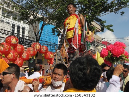 PHUKET, THAILAND - OCTOBER 12: A traditional Mah Song or Warrior in the street procession of The Phuket Vegetarian Festival in Phuket Town, Phuket, Thailand on the 12th October, 2013.