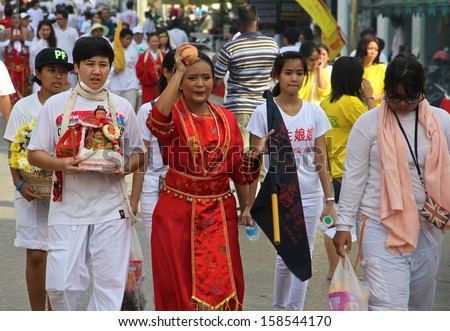 PHUKET, THAILAND - OCTOBER 12: A traditional female Mah Song or Warrior in the street procession of the Phuket Vegetarian Festival in Phuket Town, Phuket, Thailand on the 12th October, 2013.