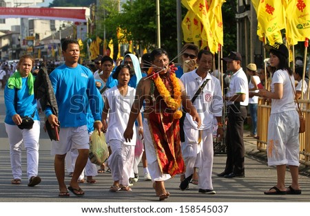 PHUKET, THAILAND - OCTOBER 12: A traditional male Mah Song or warrior in the street procession of The Phuket Vegetarian Festival on the 12th October, 2013.