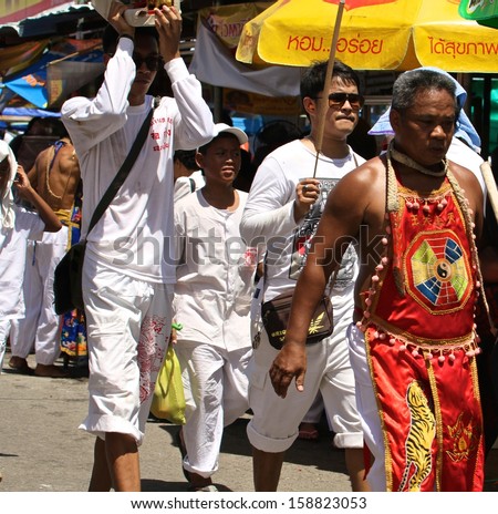 PHUKET, THAILAND - OCTOBER 13: A traditional Mah Song or warrior in the street procession of The Phuket Vegetarian Festival in Phuket Town, Phuket, Thailand on the 13th October, 2013.