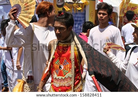 PHUKET, THAILAND - OCTOBER 13: Traditional Mah Song or warrior in the street procession of the Phuket Vegetarian Parade in Phuket Town, Phuket, Thailand on the 13th October, 2013.