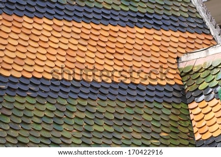 Moon shaped colorful roof tiles on the Preah Promreath Pagoda in Siem Reap, Cambodia.