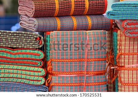 Generic colorful floor mats on display for sale in Siem Reap, Cambodia.