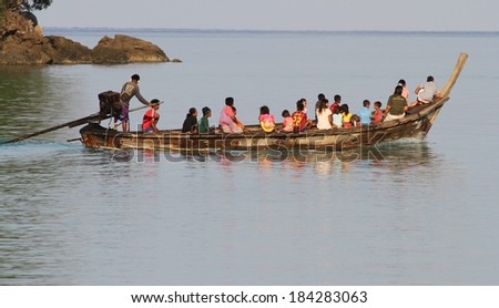 PHANG NGA, THAILAND - MARCH 11: Moken Sea Gypsies in their traditional long tail boat at Mu Ko Surin National Park, Phang Nga, Thailand on the 11th March, 2014.