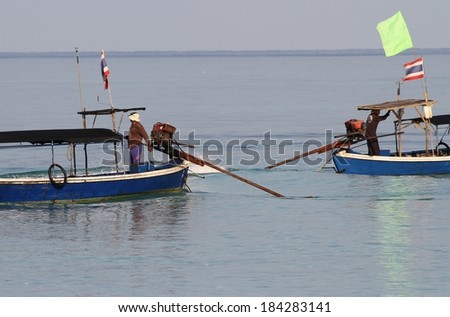 PHANG NGA, THAILAND - MARCH 11: Moken Sea Gypsies in their traditional long tail boats at Mu Ko Surin National Park, Phang Nga, Thailand on the 11th March, 2014.
