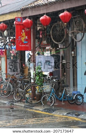 GEORGE TOWN, MALAYSIA - MAY 30: The colorful front of a shop with push bikes for hire in a street of George Town, Malaysia on the 30th May, 2014.