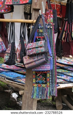 Locally hand crafted bags made by the Hmong tribe women for sale at a stall near Luang Prabang, Laos.