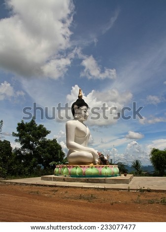 A large white statue of Buddha in the countryside of the northern province of Loei, Thailand.
