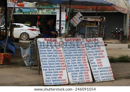 VANG VIENG, LAOS - AUGUST 10: A typical sight of price lists for snack food in the town of Vang Vieng Laos on the 10th August, 2015.