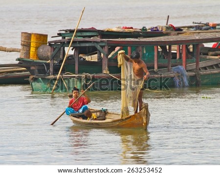 MANDALAY, MYANMAR - NOVEMBER 7:\
Local shanty town villagers fishing in the Irrawaddy River near the town of Mandalay, Myanmar on the 7th November 2012.