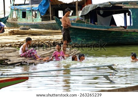 MANDALAY, MYANMAR - NOVEMBER 7:
Local impoverished children from the shanty town playing in the water of Irrawaddy River in the town of Mandalay, Myanmar on the 7th November 2012.