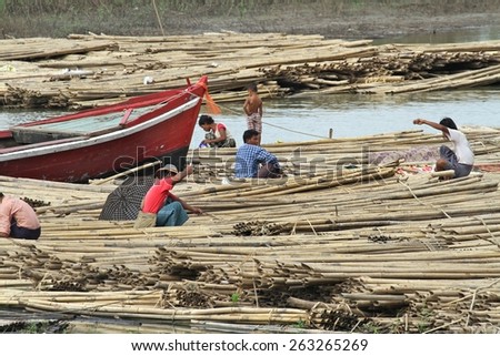 MANDALAY, MYANMAR - NOVEMBER 7:
A shanty town built on bamboo poles tied together with locals going about their daily lives on the riverbank of the town of Mandalay, Myanmar on the 7th November 2012.
