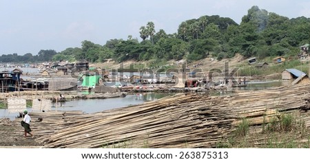 MANDALAY, MYANMAR - NOVEMBER 7:
A panoramic view of the shanty town built on bamboo poles bound together on the riverbank in the town of Mandalay, Myanmar on the 7th November, 2012.