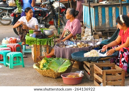 MANDALAY, MYANMAR - NOVEMBER 7:\
A group of local women selling their produce in the market place in the town of Mandalay, Myanmar on the 7th November, 2012.