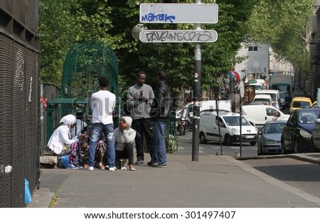 PARIS, FRANCE - April 24:\
A group of young people in the streets of the multi-racial area of the 19th Arrondissement of Paris, France on the 24th April, 2015.