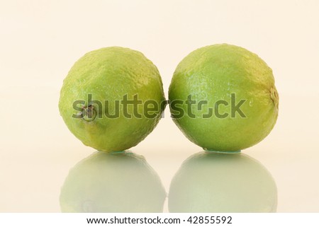 Two lemons isolated on a white background.