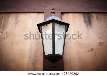 Beautiful Vintage lamp on wood wall.