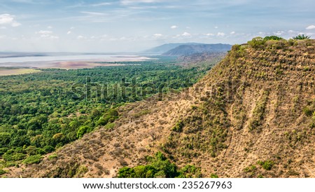 View over  Ngorongoro  Conservation Area with lake Magadi in Tanzania, East Africa. Ngorongoro Crater is a large volcanic caldera and a wildlife reserve.
