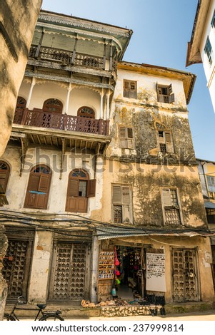 STONE TOWN, ZANZIBAR - OCTOBER 24, 2014: One of the typical narrow streets in Stone Town. Stone Town is the old part of Zanzibar City, the capital of Zanzibar, Tanzania.