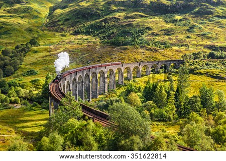Glenfinnan Railway Viaduct in Scotland with the Jacobite steam train passing over